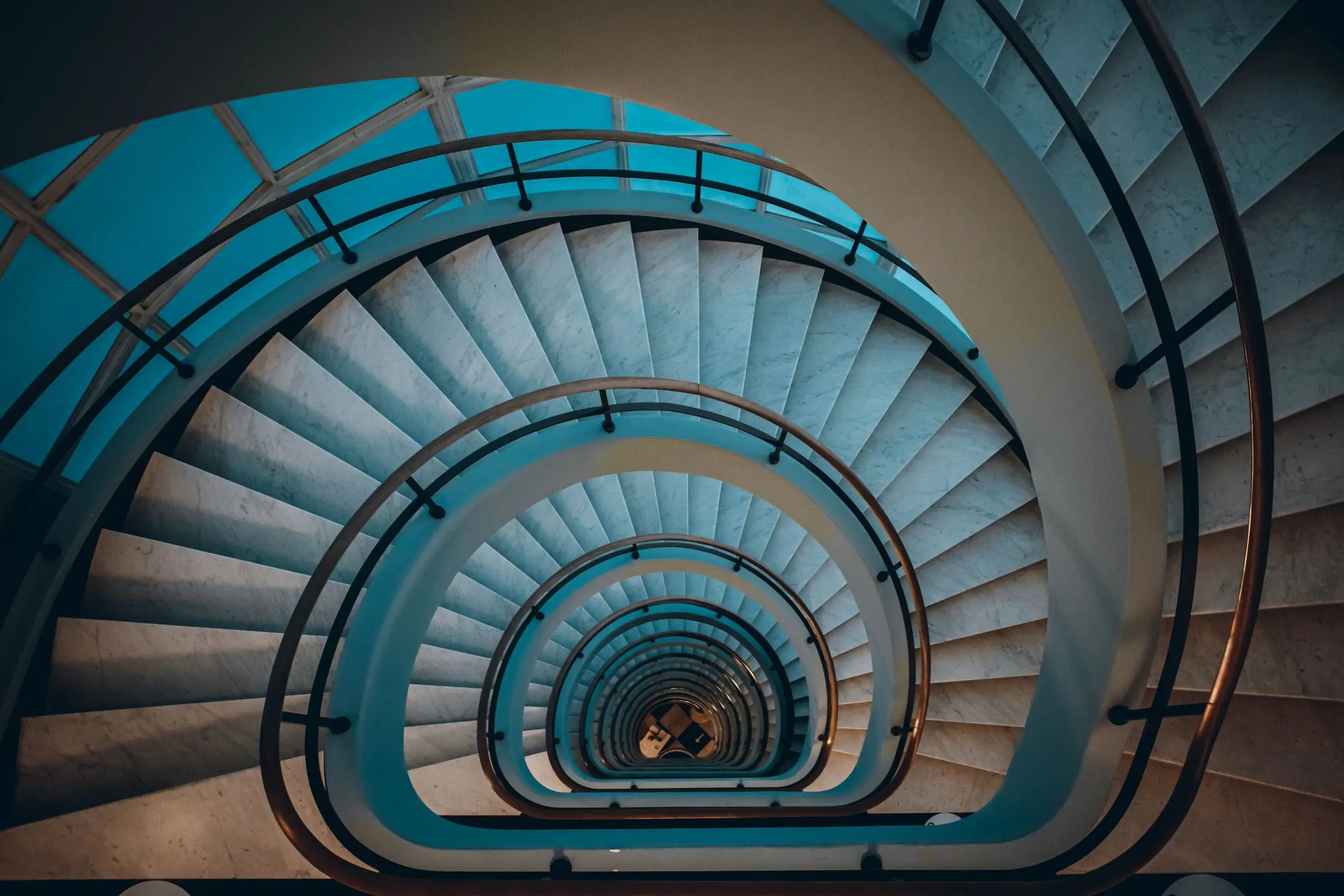 Looking down a spiral staircase that curls into the distance